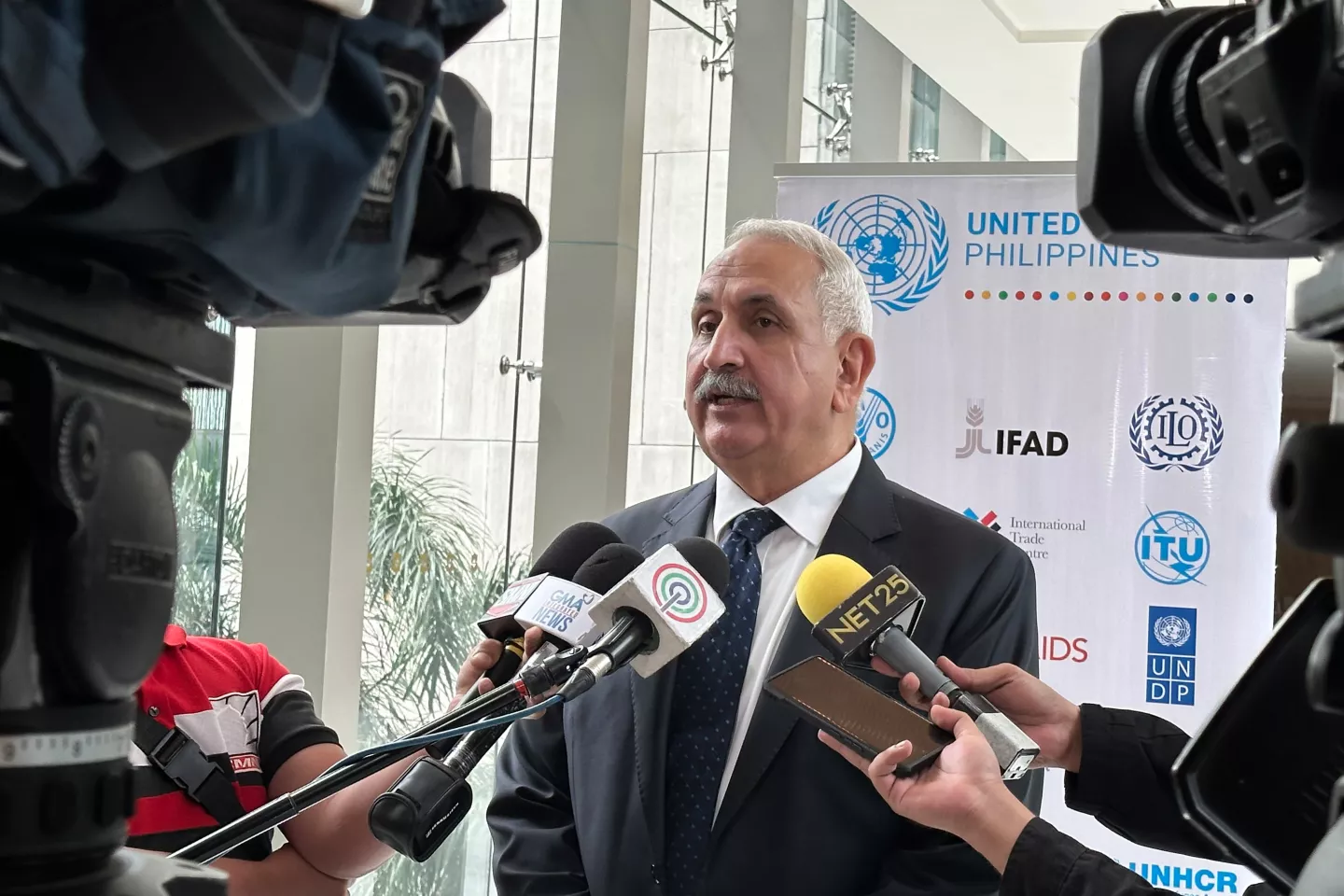 ILO Director Khalid Hassan speaks to journalists about the new UN joint programme